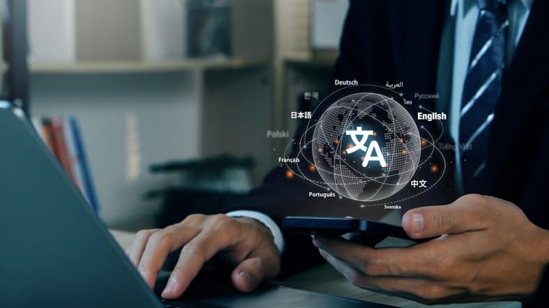 A person uses a smartphone and laptop, seamlessly navigating a digital globe displaying various languages, symbolizing translation and communication technology across industries.