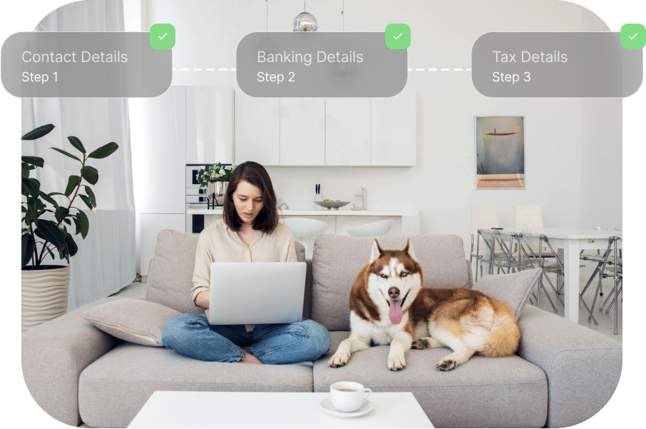 A woman sits on a couch working on a laptop with a husky next to her. Above her, a progress bar shows "Contact Details," "Banking Details," and "Tax Details," with the first two steps completed.