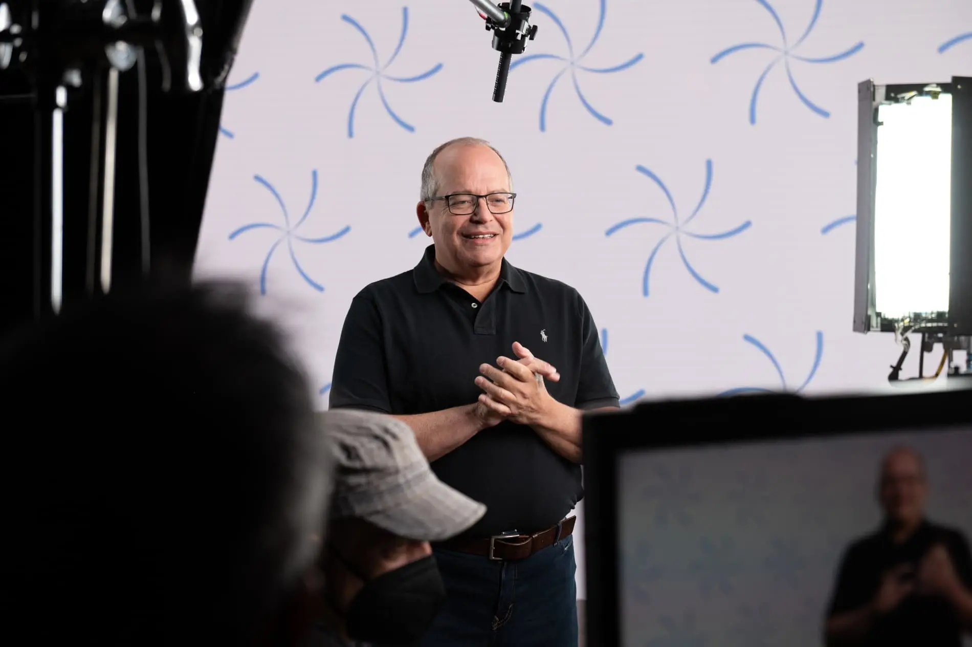 A man is standing in front of an Event Hub camera.