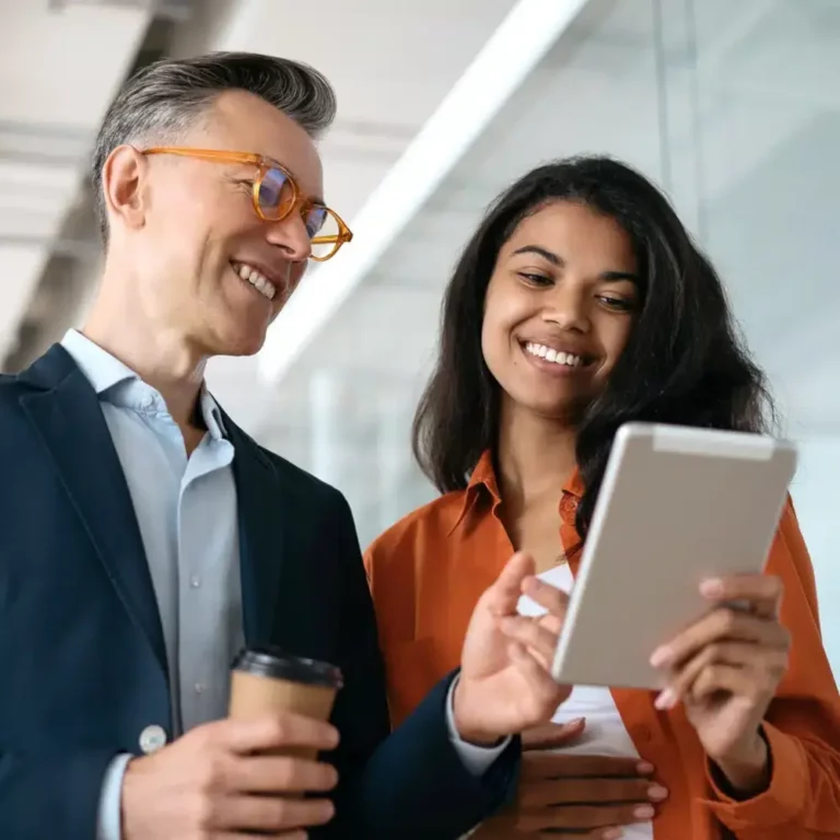 Partners are looking at a tablet computer.